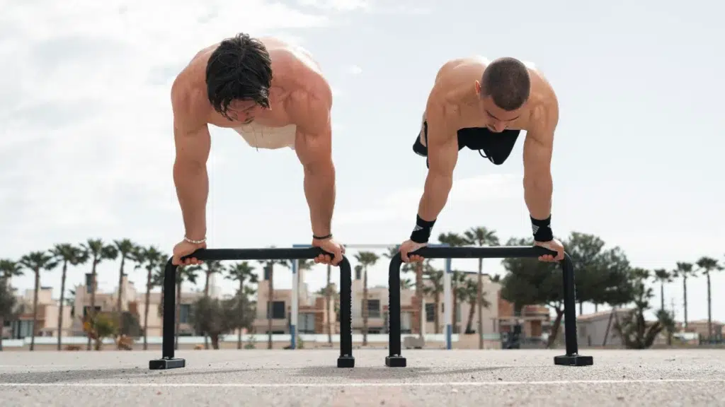 Full planche by Daniel Hristov and Simon Imhauser on metal parallettes